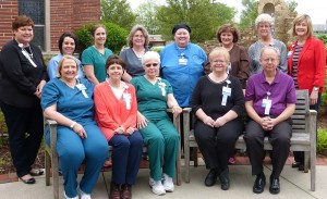 Colleagues who have given 15 or more years of service to the hospital gather in the hospital’s Healing Garden.  Front row, left to right: Marie Cyr, Cindy Herd, Joan Printz and Janet Probst (35 years); and Ross Richardson (40 years).  Second row, left to right: Mary Flach, Natalie Evans, and Audra Fleeharty (15 years); Ellen Ritz and Lucie Tuttle (25 years); Carla Douthit and Linda Willenborg (30 years); and Theresa Harner (20 years). Absent from the photo: Kelly Sager (20 years); Cheryl Osborn, Leah Passalacqua, Lynda White, Paula Bushur, Sara Konrad, and Nancy Oberlink (15 years). 