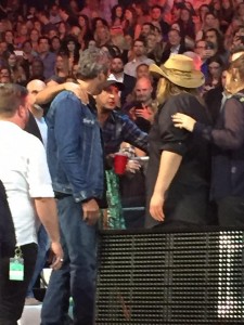This photo was taken during a commercial break at the CMT Awards.  What do you think Luke Bryan is telling Blake, Chris and Morgane?