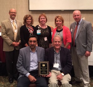 The Illinois Telehealth Network (ITN) recently received the Illinois Rural Health Association’s (IRHA) “2016 Rural Health Award of Merit” at the IRHA Educational Conference and Annual Meeting on August 11 in Effingham. Accepting the award were (sitting, from left to right): Gurpreet Mander, MD, ITN chair, and chief medical officer, HSHS St. John’s Hospital; David Imler, ITN board member, and board chair of Hillsboro Area Hospital; (standing, from left to right) David Mortimer, ITN administrative director, and Innovation Institute director, Hospital Sisters of St. Francis Foundation; Chris Schmidt, RN, BSN, ITN network director, and regional stroke and telemedicine nurse coordinator, HSHS St. John’s Hospital; Tammy Lett, RN, MBHA, ITN Tele-Behavioral Health Committee co-chair, and chief nursing officer, HSHS Holy Family Hospital, (Greenville, IL); Margaret Vaughn, executive director, IRHA; Ryan Jennings, MD, ITN Tele-Behavioral Health Committee co-chair, and chief medical officer, HSHS St. Anthony’s Memorial Hospital (Effingham, IL).