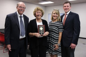 The Lake Land College Board of Trustees posthumously honored Karen Fuqua with the Clem G. Phipps Exemplary Trustee Award during the August meeting at the Kluthe Center in Effingham. Fuqua’s family including her sister, Marilyn Fuqua Thompson and her niece Nicole Zeller and her husband, Eric Zeller, received the award on her behalf. Pictured left to right are Gary Cadwell, chairman of the board of trustees, Fuqua Thompson, Nicole Zeller and Zeller.